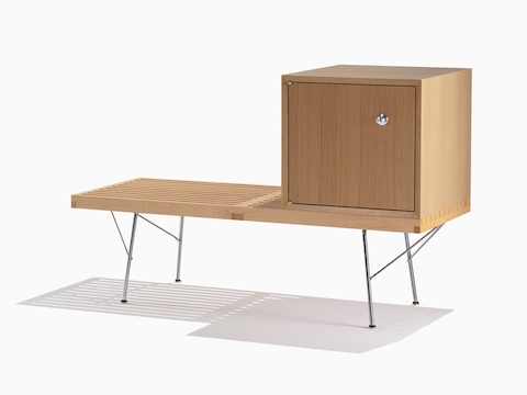 A Nelson Basic Cabinet Series closed storage module sits atop a Nelson Platform Bench, both with light finishes.