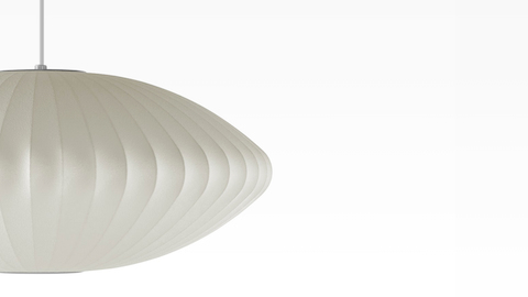 Partial view of a Nelson Saucer Bubble white pendant lamp.