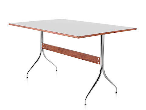 A rectangular Nelson Swag Leg Table with a white top, showing a single walnut stretcher between tubular steel legs.