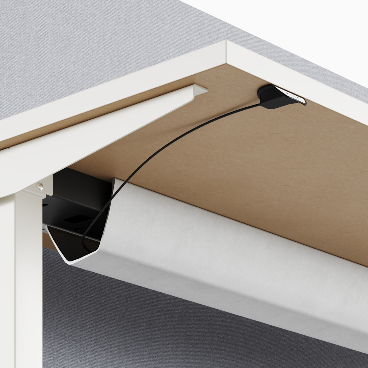 A close-up view of Nevi standing desk's under-surface cable management.