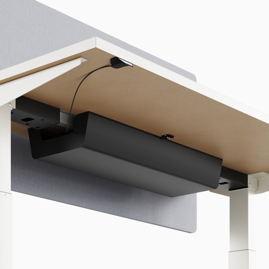 A close-up view of Nevi standing desk's under-surface cable management.