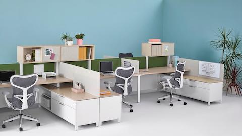Tackable Pari Screens provide privacy for a run of Canvas Dock workstations with gray Mirra 2 office chairs.