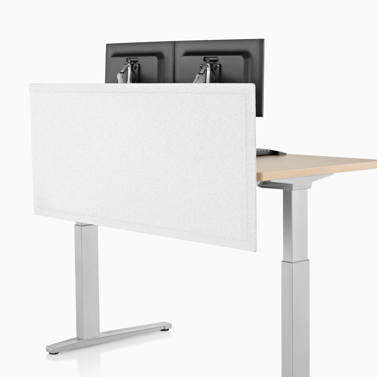 Viewed at an angle, the front side of a light gray, tapered-edge fabric, surface-attached screen on a rectangular Renew Sit-to-Stand Table.