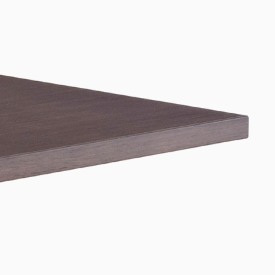 Close-up view of dark wood Renew Sit-to-Stand Table with a square edge work surface.