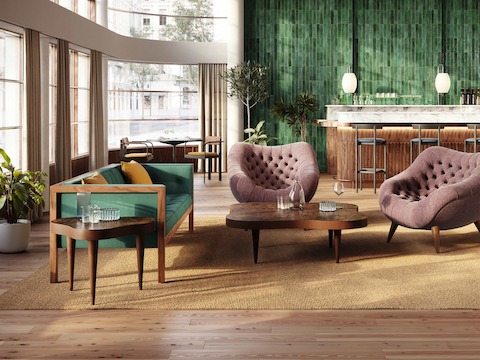 Espacio de lounge con sofá Nelson Cube, poltronas Rohde y mesa auxiliar y mesa de café Rohde Paldao en madera de nogal.