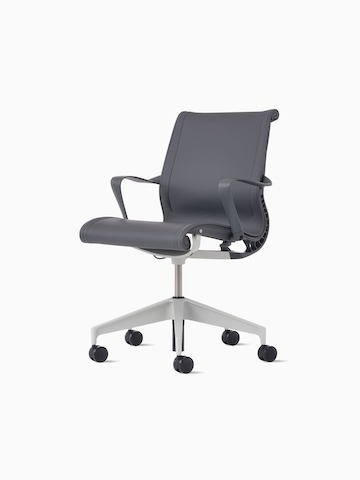 Front-angle view of a Setu Chair with carbon upholstery and frame and a silver alloy base.