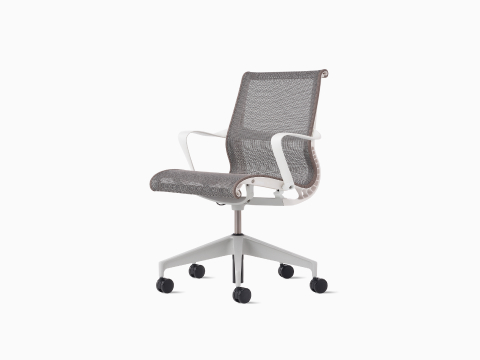 Front-angle view of a Setu Chair with fixed arms and frame in white, base in silver and suspension in light brown.