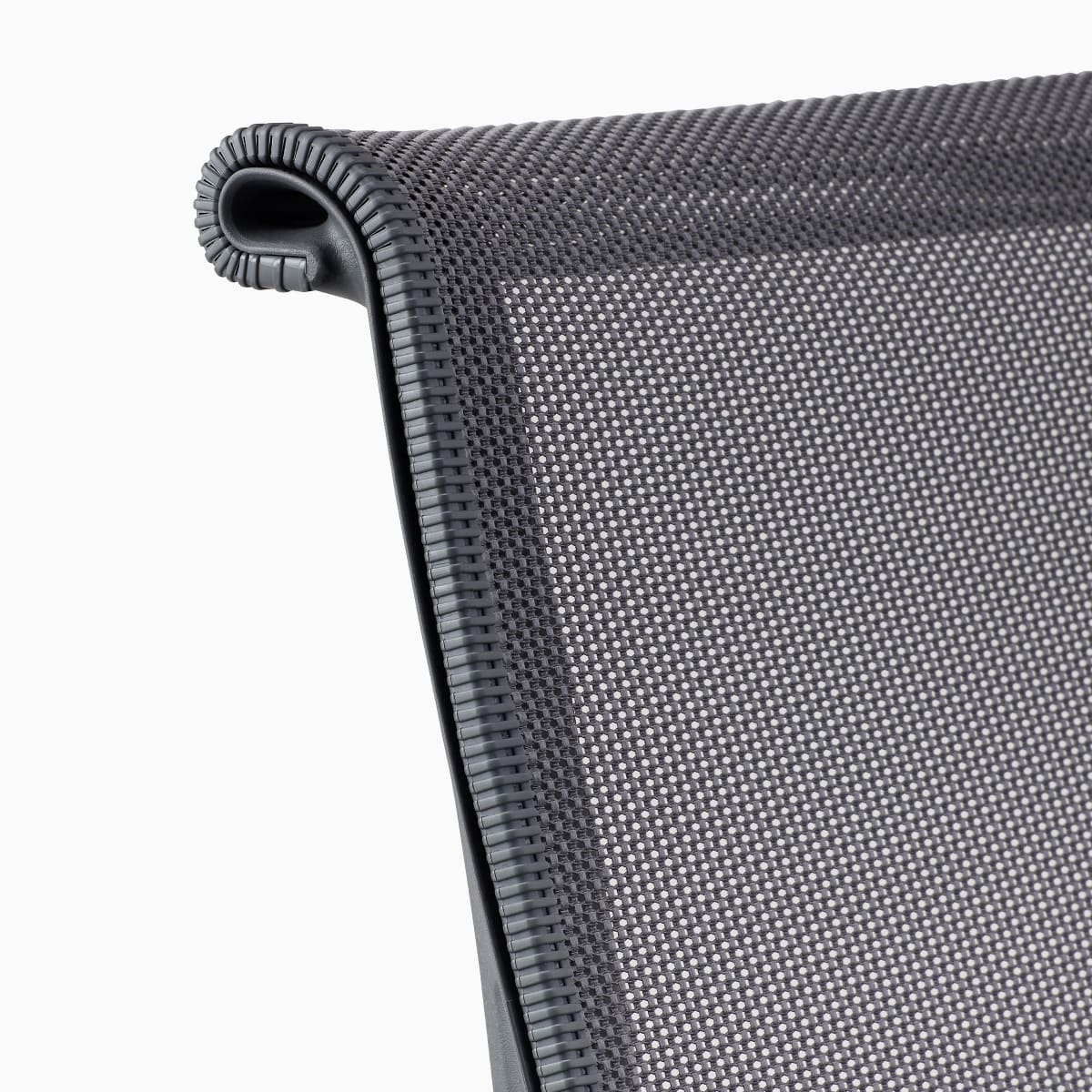 A close-up view of the bumper on a grey Setu chair.