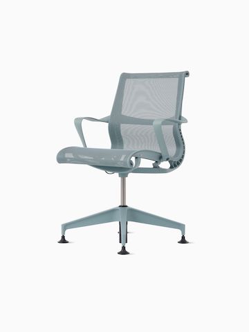 Front-angle view of a Setu Side Chair with fixed arms in light blue.