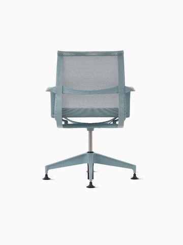 Rear view of a Setu Side Chair with fixed arms in light blue.