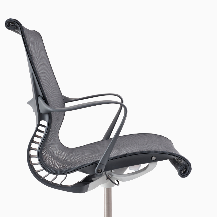 A close-up side view of a Setu chair with arms in grey.