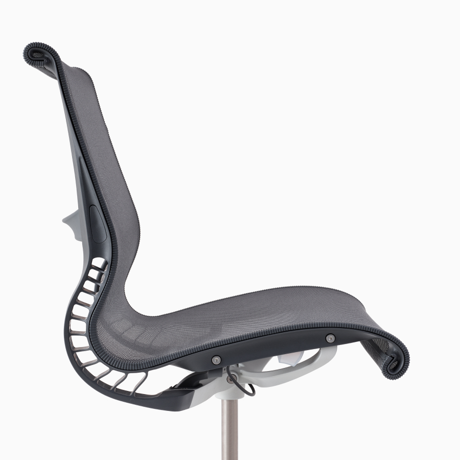 A close-up side view of a Setu chair without arms in grey.