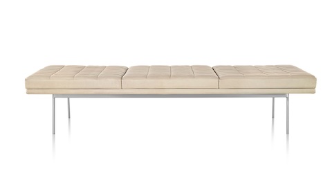 Tan Tuxedo Bench with quilted upholstery and bright chrome base, viewed from the front.