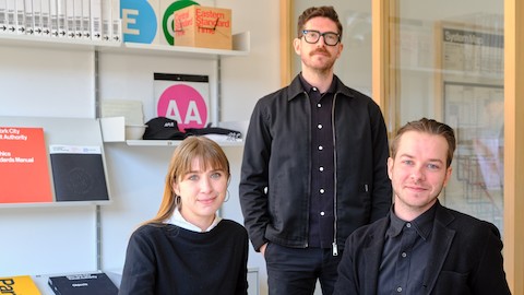 The Order team at their studio on Franklin Street in Greenpoint, Brooklyn. Seated are Megan Nardini, head of operations, and Garrett Corcoran, design director; Jesse Reed, co-founder of Order, is standing.