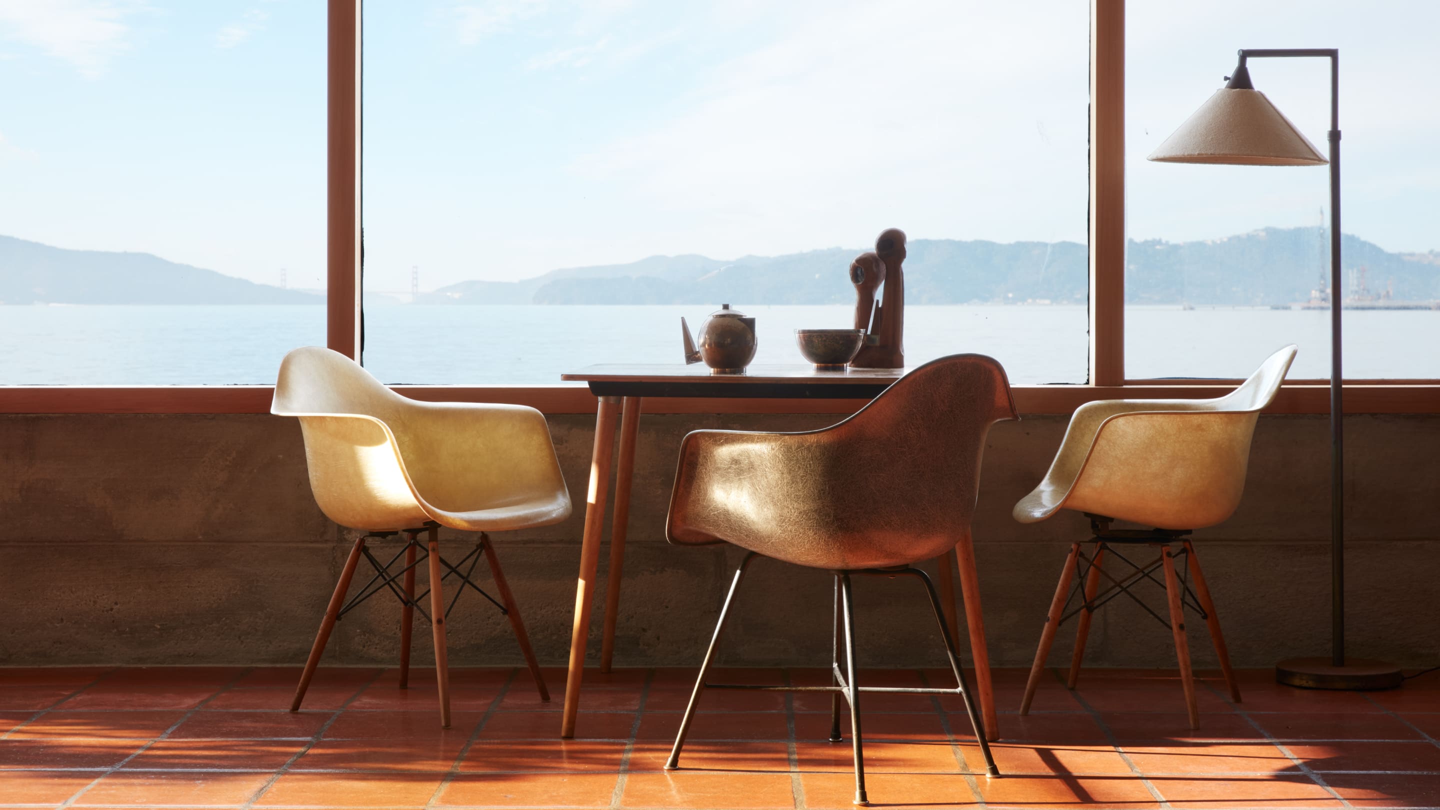 A trio of Eames vintage fiberglass armchairs in Steve Cabella's home overlooking San Francisco Bay.