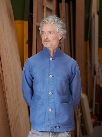 Artist and woodworker Jesse Schlesinger in a blue shirt.